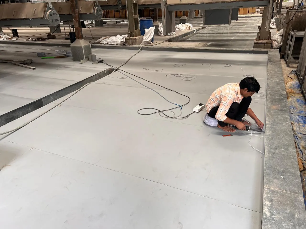 Welding polypropylene sheet seams over granite — second acid barrier in battery formation area